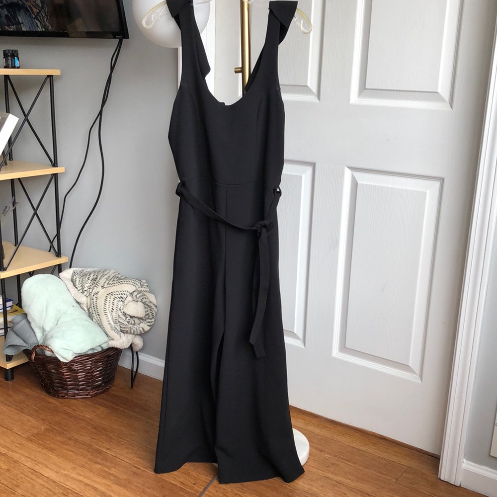 Black cropped jumpsuit with ruffle tie back